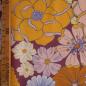 Preview: Viskose Druck Retro Blütenmischung violett gelb orange